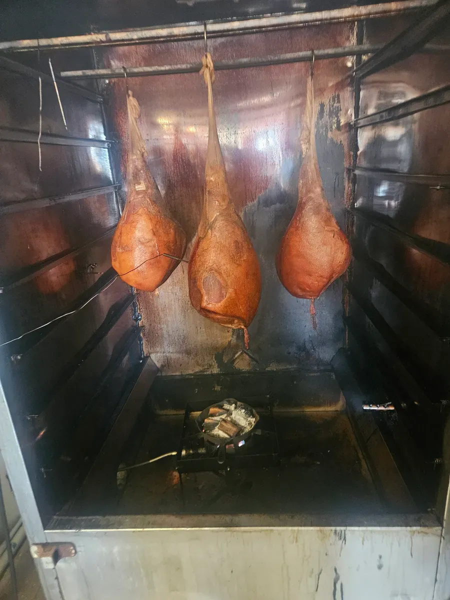 Hams smoking in the smoker