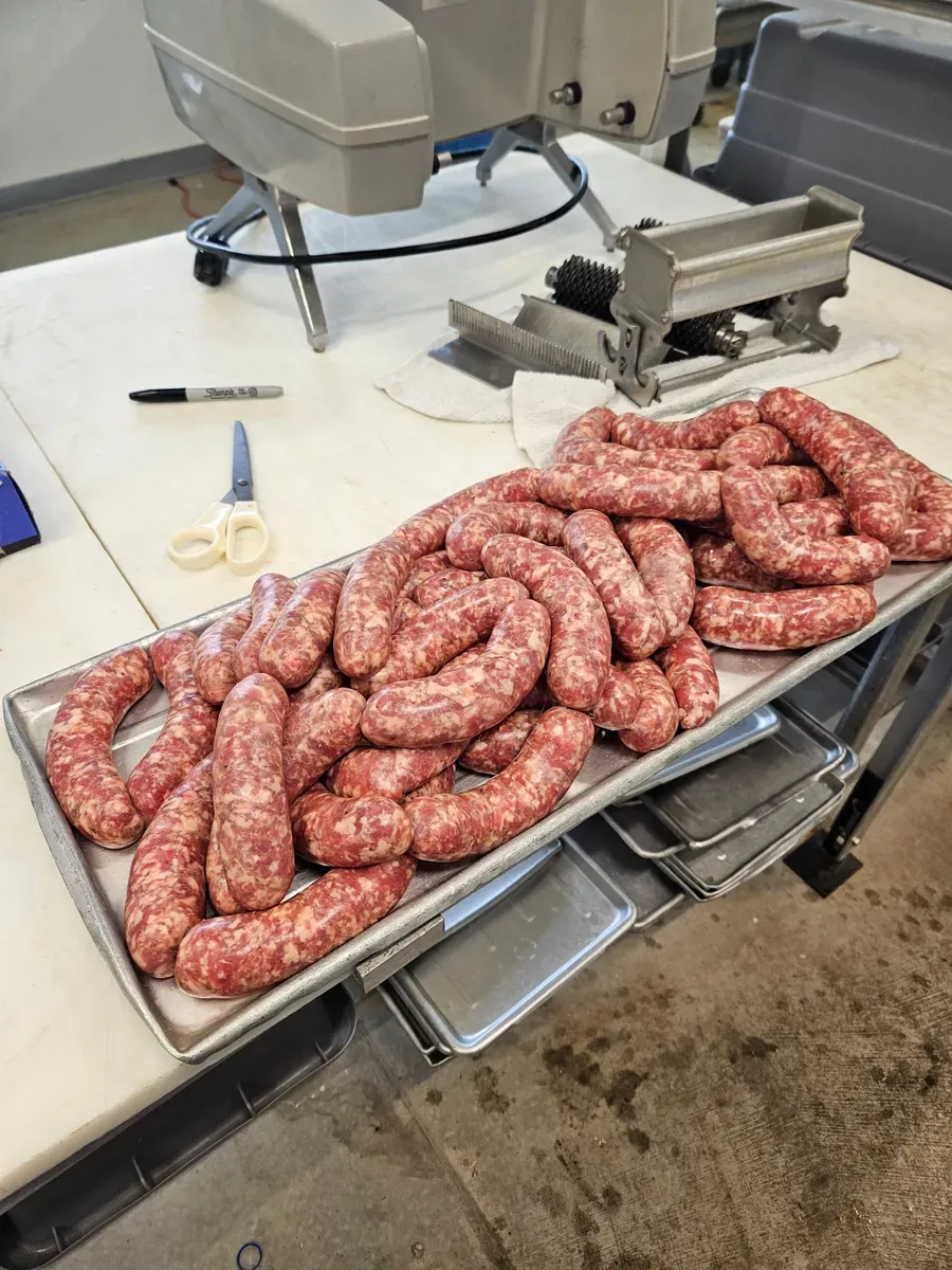 Fresh handmade sausage links crafted with custom spice blends at H&M Custom Meat, Creston WA