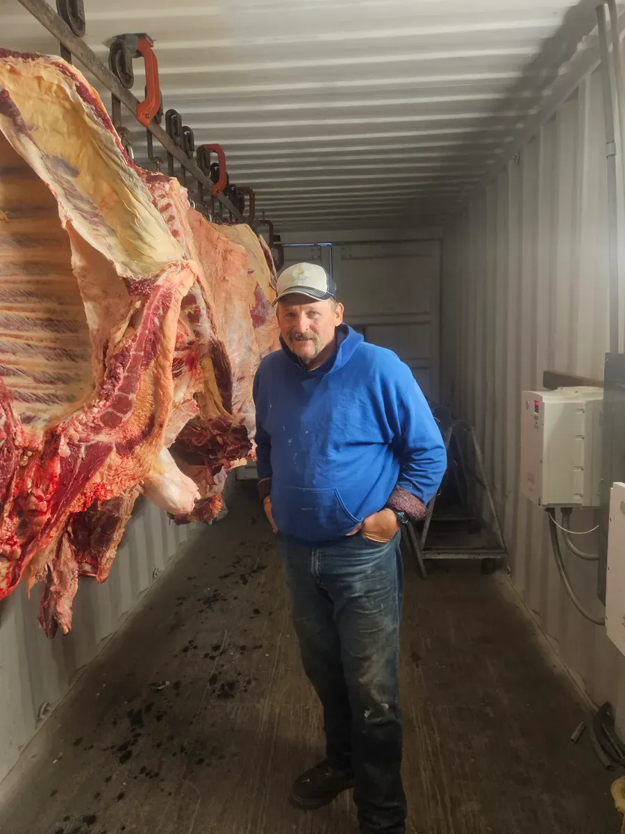 Howard Larson in the cooler at H&M Custom Meat