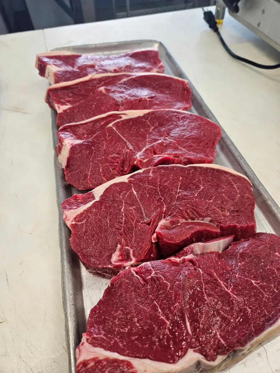 Fresh sirloin steaks cut to customer specifications at H&M Custom Meat, Creston WA