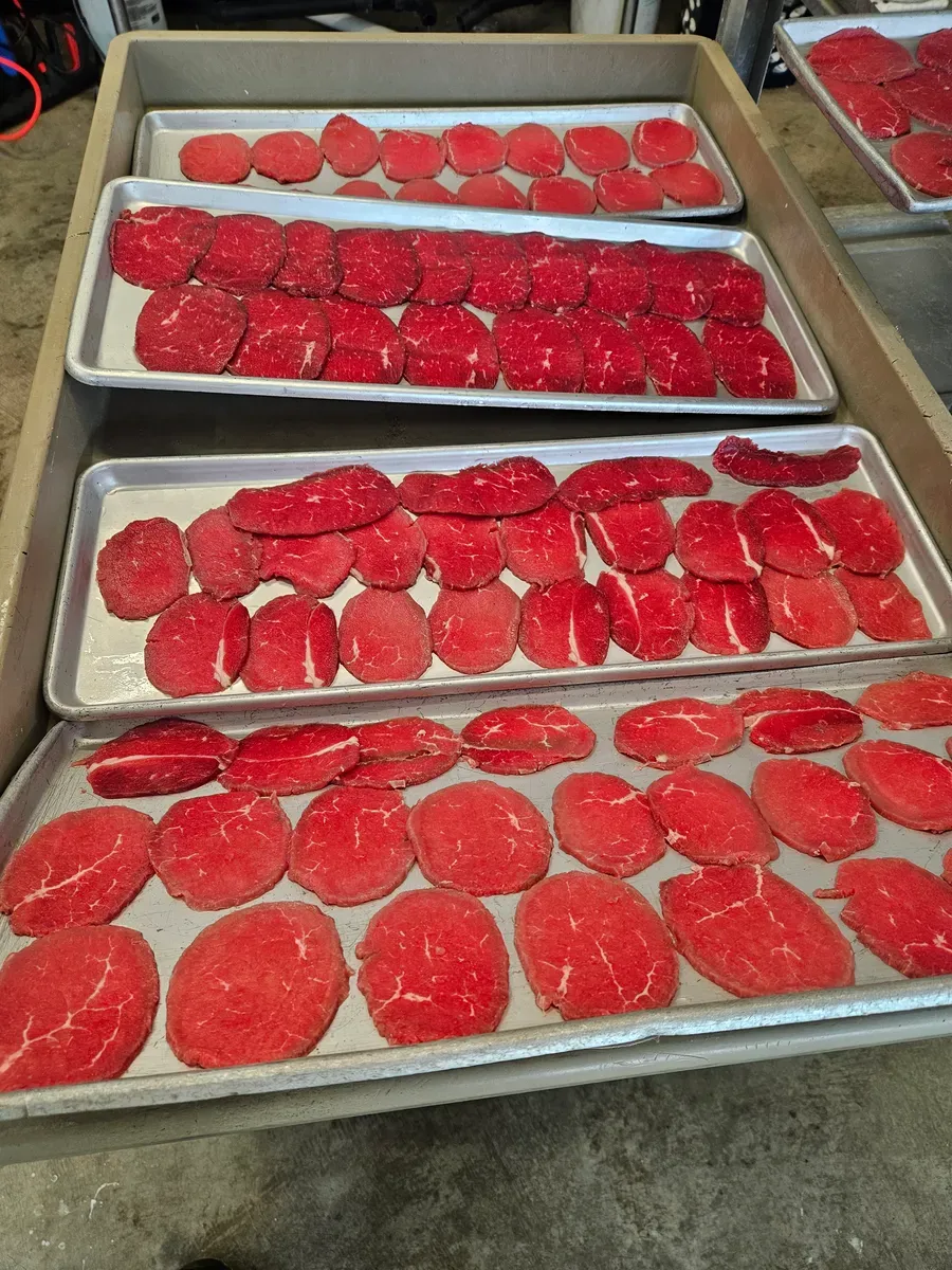 Sliced beef laid out to be made into jerky at H&M Custom Meat in Creston, WA