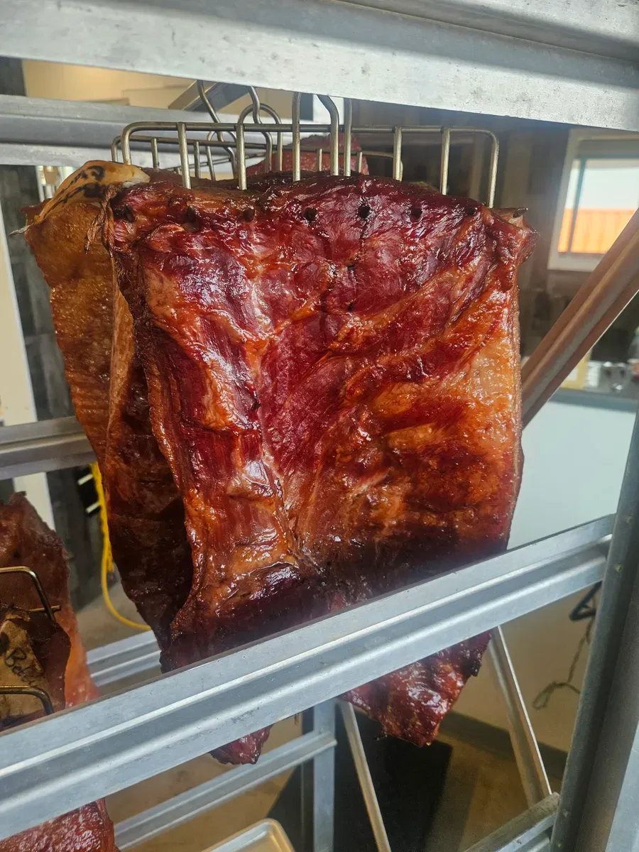 Thick slab of house-smoked bacon before slicing at H&M Custom Meat, Creston WA
